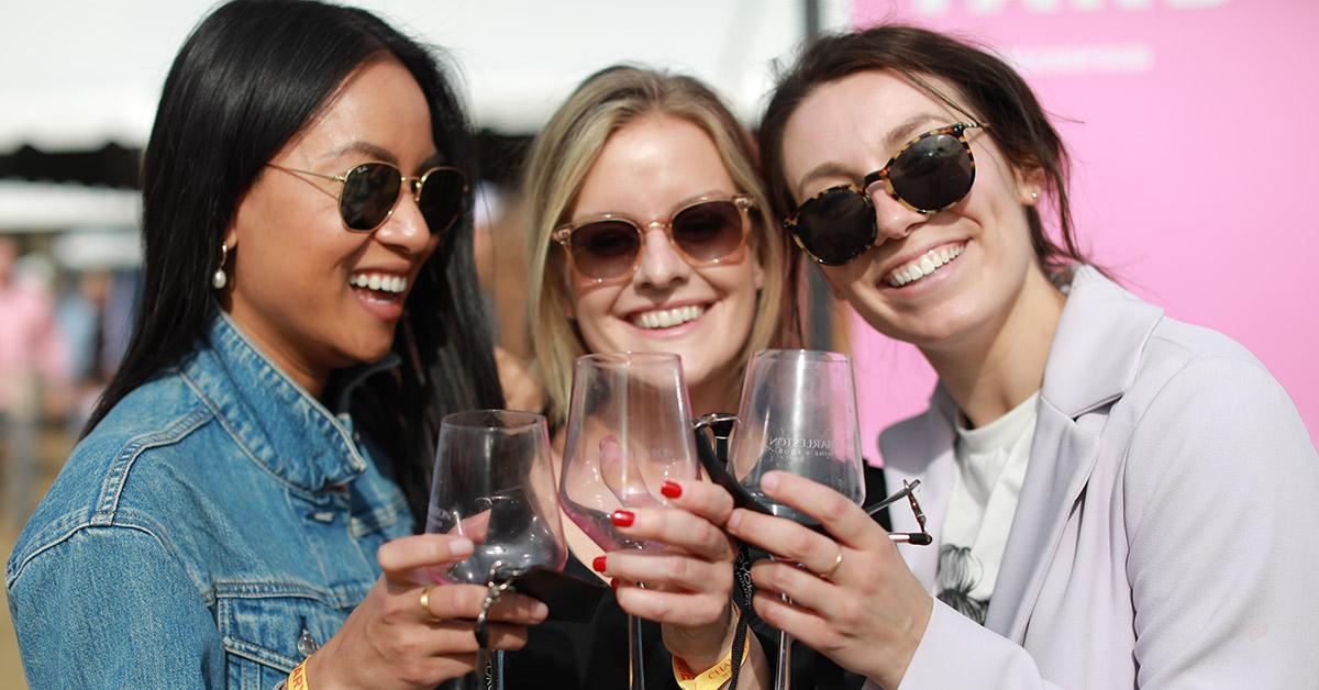 women holding wine glasses