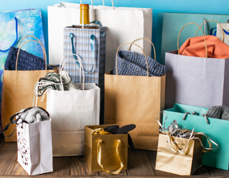 The Ultimate Charleston Gift Guide A group of gift bags lined up near a wall