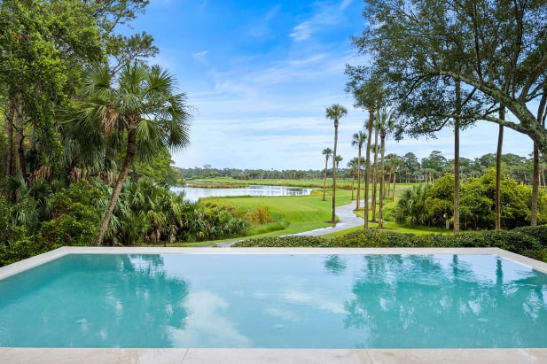 kiawah island home with pool overlooking golf course and pond