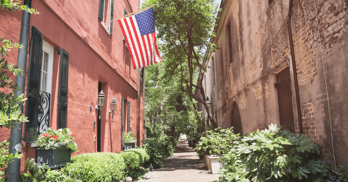 downtown charleston alleyway house with american flag