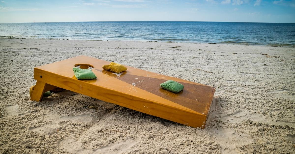 corn hole board on beach